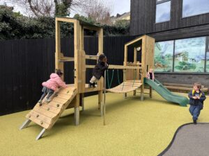 Playing on the Climb N Slide unit